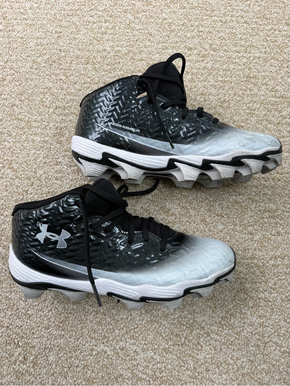 UA boys size 7.  Spotlight hammer football cleats, like new!